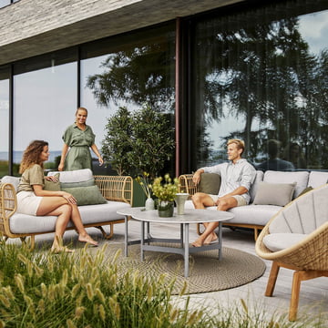 Het stijlvolle en comfortabele Nest Outdoor meubilair van Cane-line op het terras