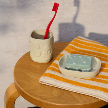 Marimekko - Raide badhanddoek, sahram geel/crème, Unikko badkameraccessoireset