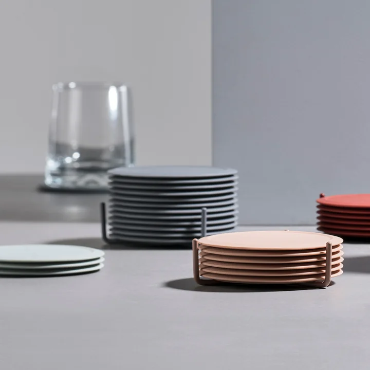 Glazen onderzetter van Zone Denmark op de tafel