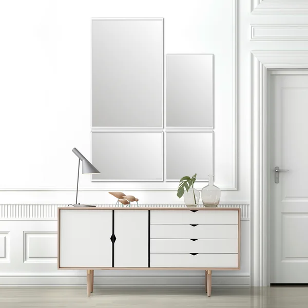 De VertiMirror wandspiegel van Verti Copenhagen boven een wit dressoir